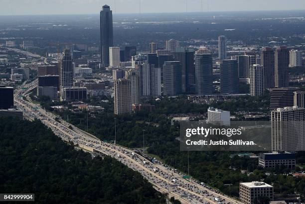 Traffic backs up on a freeway on September 5, 2017 in Houston, Texas. The Army National Guard is using helicopters to drop hay for cattle that is...