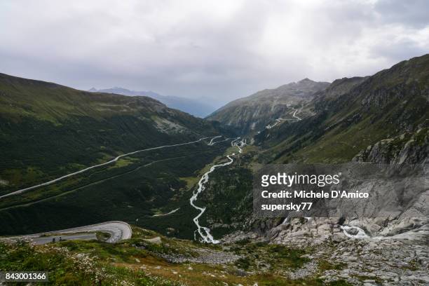 the road to furkapass in a wild alpine valley - rhone stock-fotos und bilder