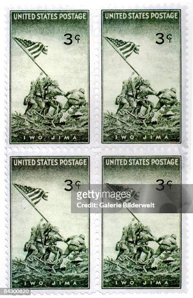 Commemorative stamp worth three cents, depicting the raising of the US flag on Iwo Jima during World War II, 1945. From a photo by Joe Rosenthal,...