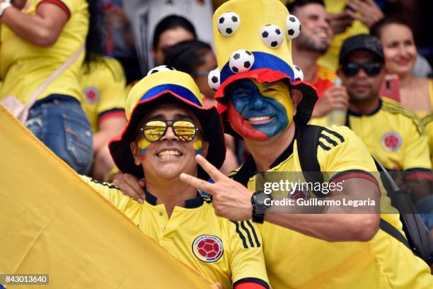 Fans of Colombia cheer for their team prior a match between Colombia and Brazil as part of FIFA 2018 World Cup Qualifiers at Metropolitano Roberto...