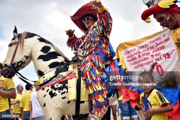 Fans of Colombia cheer for their team prior a match between Colombia and Brazil as part of FIFA 2018 World Cup Qualifiers at Metropolitano Roberto...