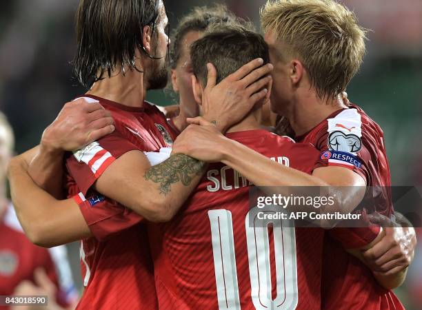 Austria's Louis Schaub celebrates scoring an equalizer making it 1-1 during the Group D FIFA World Cup 2018 qualification match between Austria and...