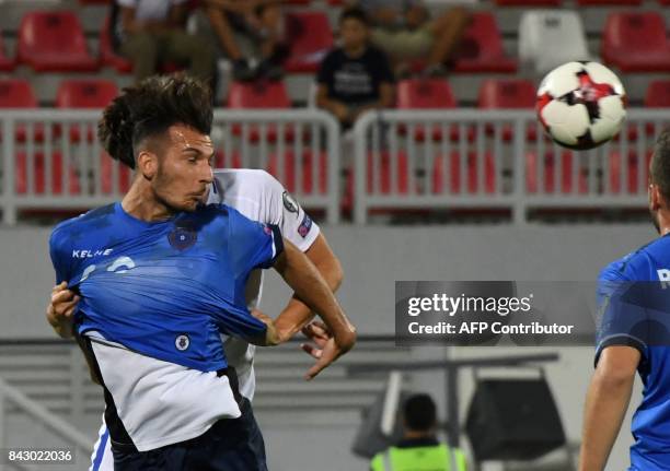 Kosovo's defender Leart Paqarada heads the ball during the FIFA World Cup 2018 qualification football match between Kosovo and Finland at Loro Borici...