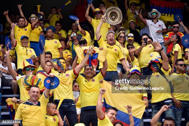 Fans of Colombia cheer for their team prior a match between Colombia and Brazil as part of FIFA 2018 World Cup Qualifiers at Metropolitano Roberto...