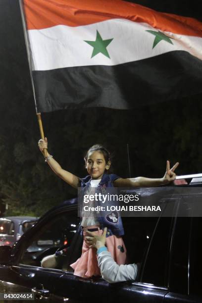 Young Syrian football fan celebrates in the streets of Damascus after the FIFA World Cup 2018 qualification football match between Iran and Syria...