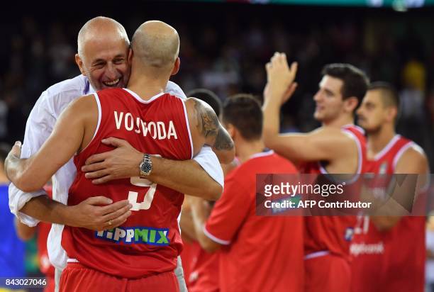Coach Stojan Ivkovic and David Vojvoda of Hungary celebrate victory against Romania in the Group C basketball match of the FIBA Eurobasket 2017...