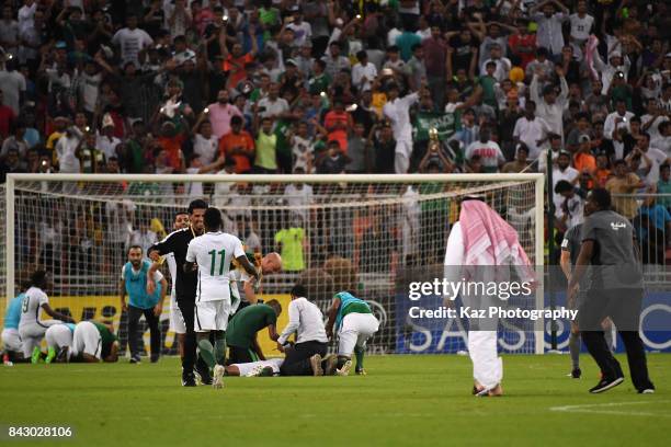 Saudi Arabia players and team staffs celebrate their 1-0 victory and qualified for the FIFA World Cup Russia after the FIFA World Cup qualifier match...