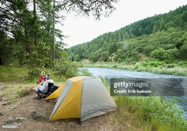 couple relaxing at campsite - rogue river oregon stock pictures, royalty-free photos & images