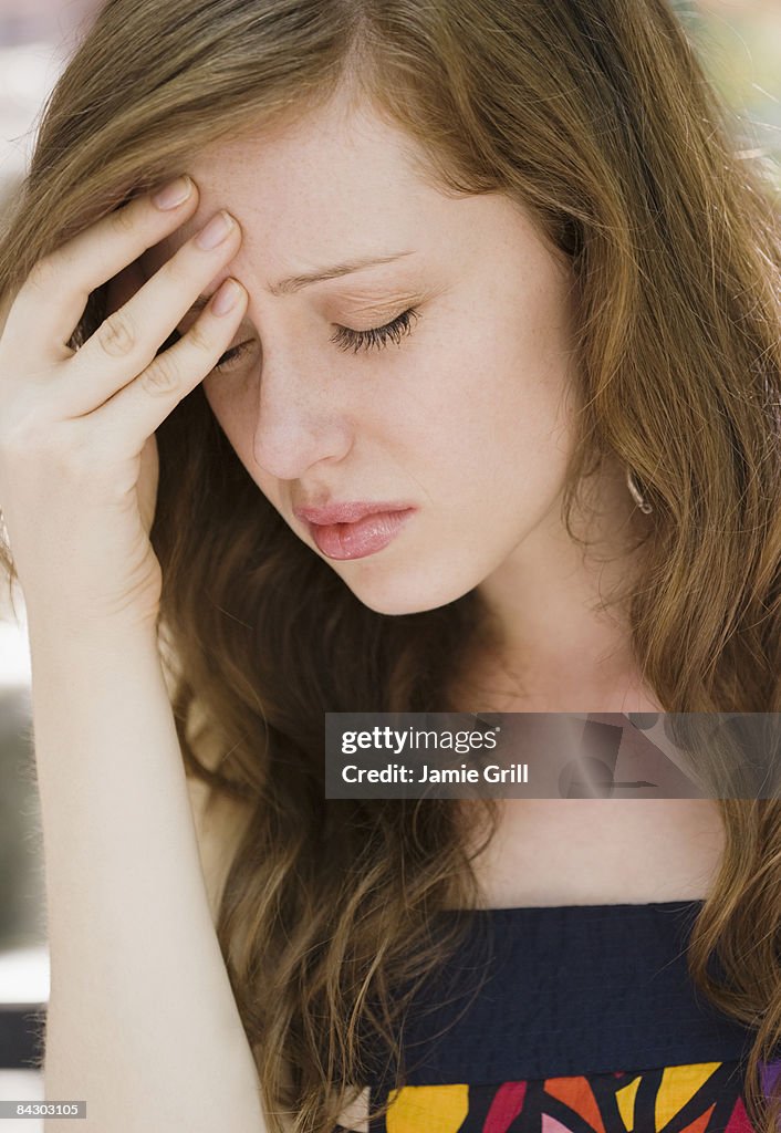 Young woman with headache