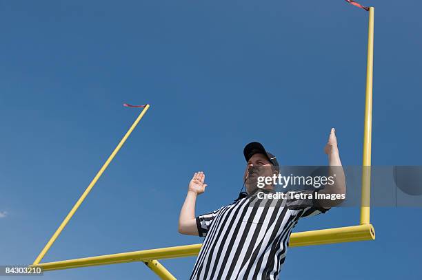 football referee calling field goal - sports official stockfoto's en -beelden