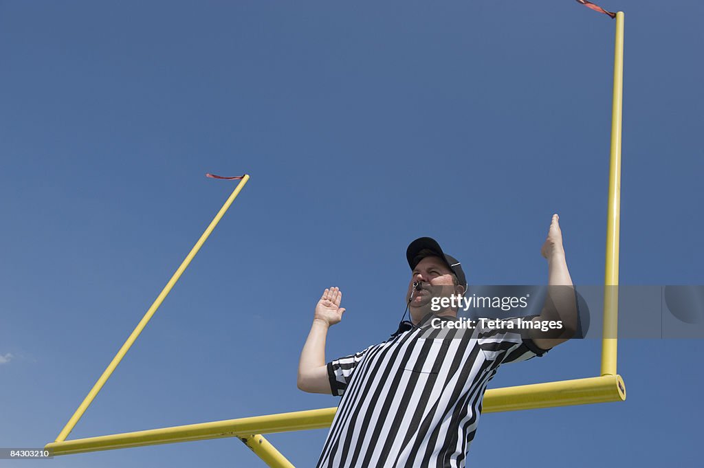 Football referee calling field goal