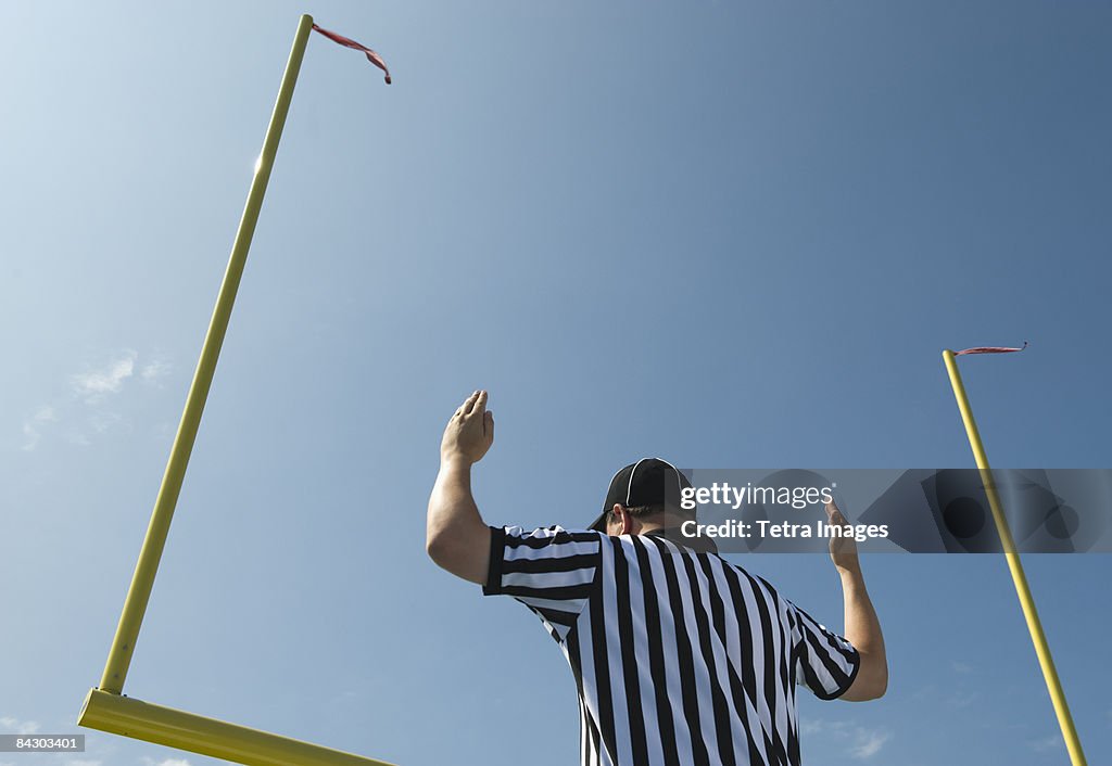 Football referee calling field goal