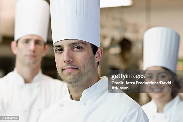 professional chefs in uniforms - toque stock pictures, royalty-free photos & images