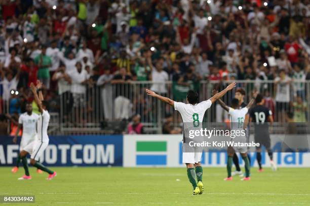 Saudi Arabia players celebrate their 1-0 victory and qualified for the FIFA World Cup Russia after the FIFA World Cup qualifier match between Saudi...