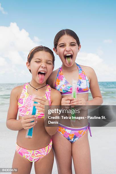 girls eating ice pops on beach - tampa food stock pictures, royalty-free photos & images