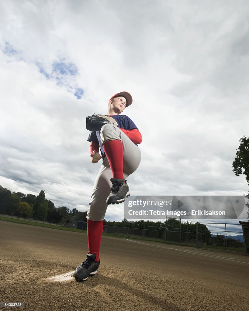 Baseball pitcher getting ready to throw ball