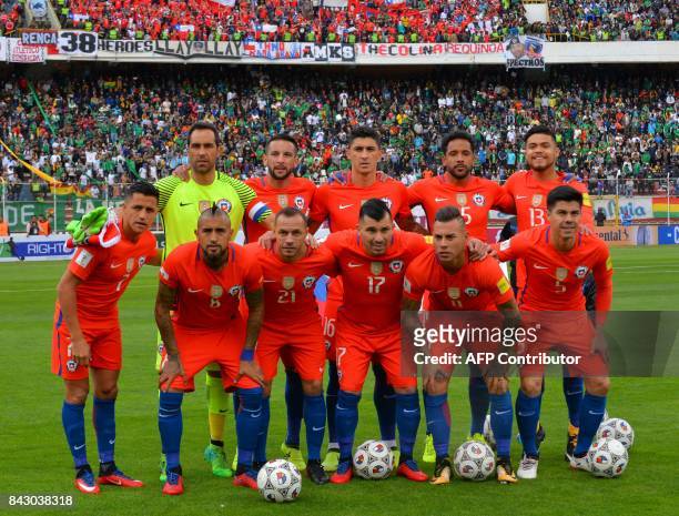 Players of Chile pose for pictures before the start of their FIFA 2018 World Cup qualifier football match against Bolivia in La Paz, on September 5,...