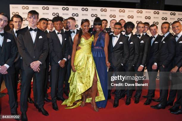 Aicha Mckenzie and Vanessa Kingori pose with models at the GQ Men Of The Year Awards at the Tate Modern on September 5, 2017 in London, England.