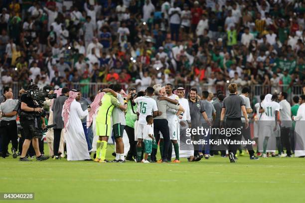 Saudi Arabia players celebrate their 1-0 victory and qualified for the FIFA World Cup Russia after the FIFA World Cup qualifier match between Saudi...