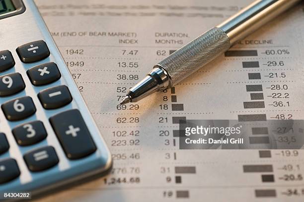 close up of pen, calculator and financial pages - calculator top view stock pictures, royalty-free photos & images