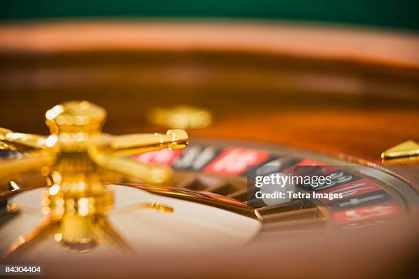 close up of spinning roulette wheel - roulette stock pictures, royalty-free photos & images