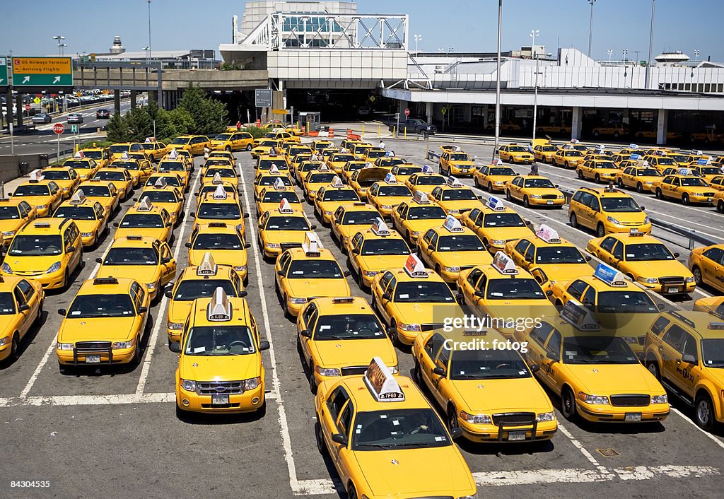 Rows of taxis waiting at airport