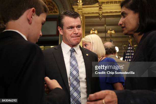 Sen. Todd Young talks with Centers for Medicare and Medicaid Services Administrator Seema Verma following the swearing in ceremony for U.S. Surgeon...
