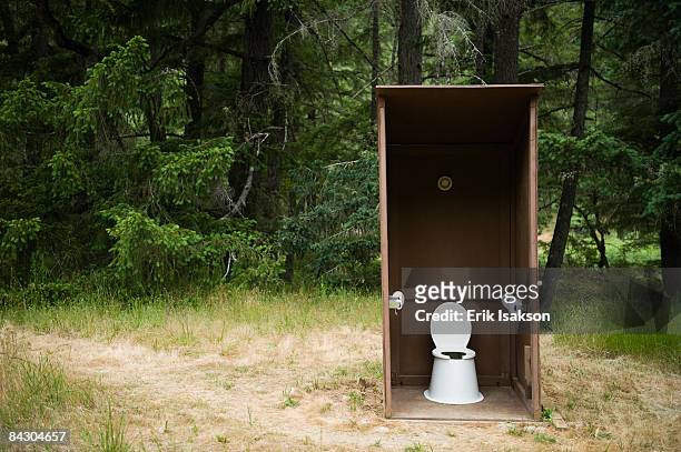 outhouse in forest - outhouse stock pictures, royalty-free photos & images