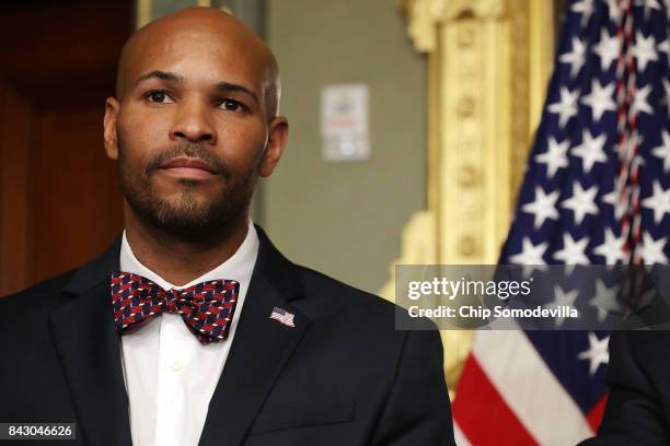 Dr. Jerome Adams prepares to be sworn in as U.S. Surgeon General during a ceremony in the Eisenhower Executive Office Building September 5, 2017 in...