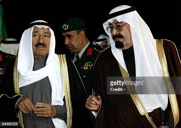 The Emir of Kuwait Sheikh Sabah al-Ahmad al-Sabah talks with and Saudi King Abdullah bin Abdul Aziz al-Saud as the Kuwaiti delegation follows upon...