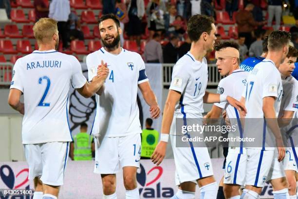 Finland's players celebrate at the end of the FIFA World Cup 2018 qualification football match between Kosovo and Finland at Loro Borici stadium in...