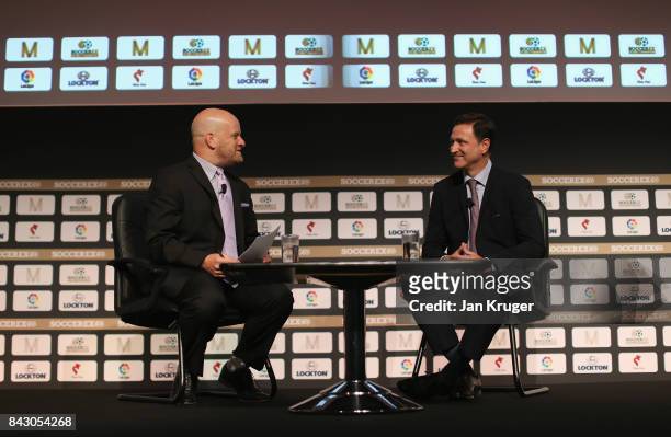 Philippe Moggio , CONCACAF Secretary General talks to Ben Grossman, Minnesota United FC Co-Owner during day 2 of the Soccerex Global Convention at...