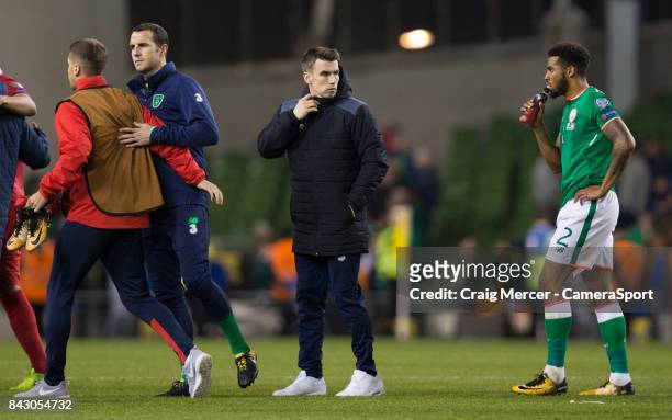 Republic of Ireland's Seamus Coleman is seen on the pitch supporting his team mates after the FIFA 2018 World Cup Qualifier between Republic of...