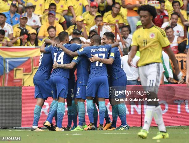 Willian of Brazil celebrates with teammates after scoring the opening goal during a match between Colombia and Brazil as part of FIFA 2018 World Cup...