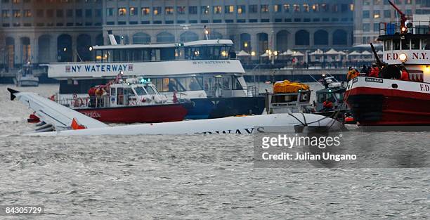Airways plane comes to rest in the water near Battery Park after crashing into the Hudson River in the afternoon on January 15, 2009 near the Battery...