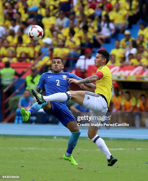 James Rodriguez of Colombia and Dani Alves of Brazil compete for the ball during a match between Colombia and Brazil as part of FIFA 2018 World Cup...