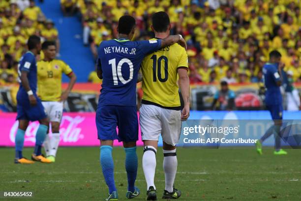 Brazil's Neymar and Colombia's James Rodriguez talk during their 2018 World Cup qualifier football match in Barranquilla, Colombia, on September 5,...