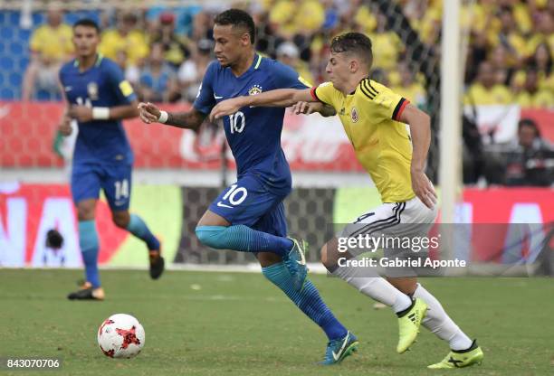 Neymar Jr. Of Colombia struggles for the ball with Santiago Arias of Brazil during a match between Colombia and Brazil as part of FIFA 2018 World Cup...