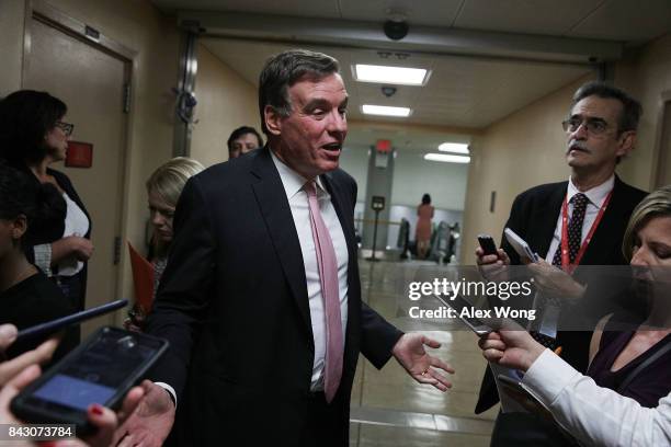 Sen. Mark Warner speaks to members of the media as he arrives for a vote at the Capitol September 5, 2017 in Washington, DC. Congress is back from...