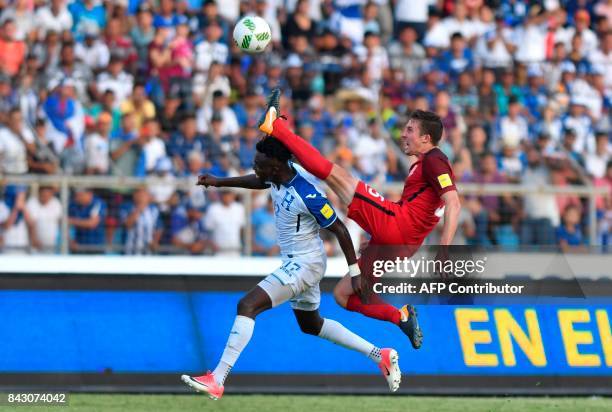 Honduras' Alberth Elis and USA's Matt Besler vie for the ball during their 2018 World Cup qualifier football match in San Pedro Sula, Honduras, on...