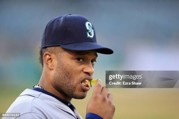 Robinson Cano of the Seattle Mariners stands by the dugout during their game against the Oakland Athletics at Oakland Alameda Coliseum on April 20,...