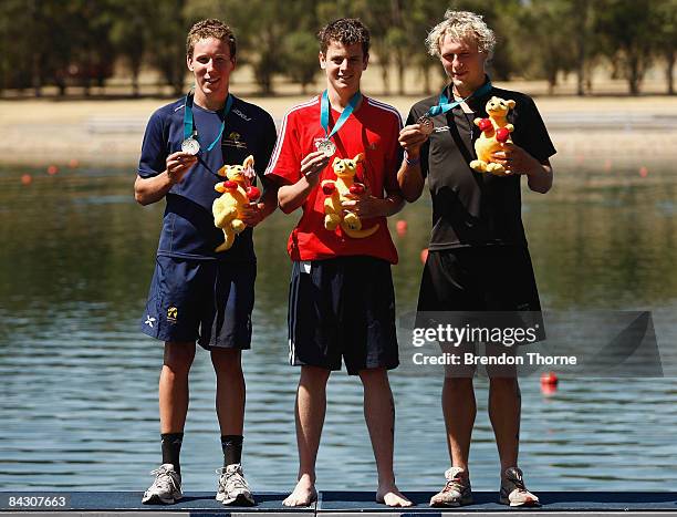 2nd place Sam Appleton of Australia, 1st place Jonathan Brownlee of Great Britain and 3rd place Jos Hoetjes of New Zealand stand on the podium during...