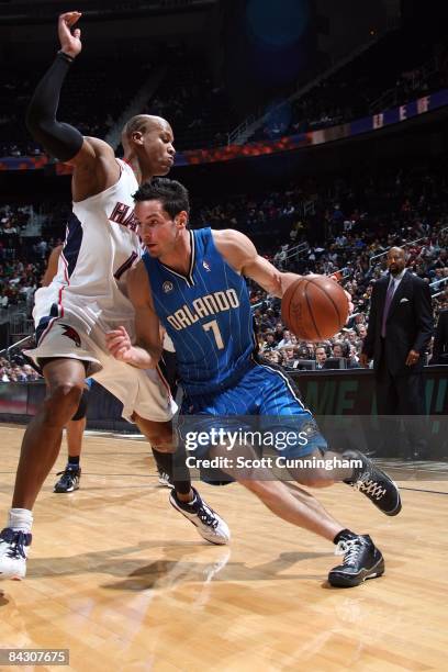 Redick of the Orlando Magic drives to the basket against Maurice Evans of the Atlanta Hawks during the game at Philips Arena on January 7, 2009 in...