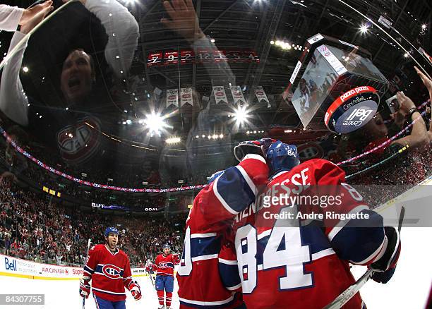 Guillaume Latendresse of the Montreal Canadiens celebrates his first period goal against the Nashville Predators with teammates and fans at the Bell...