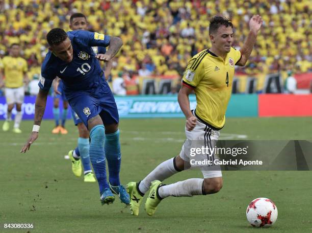 Santiago Arias of Colombia struggles for the ball with Neymar Jr. Of Brazil during a match between Colombia and Brazil as part of FIFA 2018 World Cup...