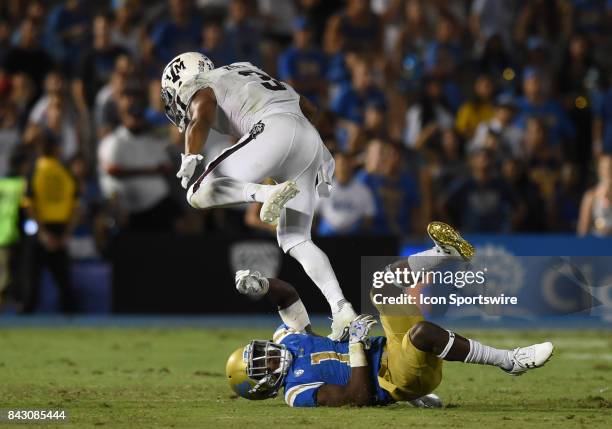 Darnay Holmes gets stepped on by Texas A&M Christian Kirk during a college football game between the Texas A&M Aggies and the UCLA Bruins on...