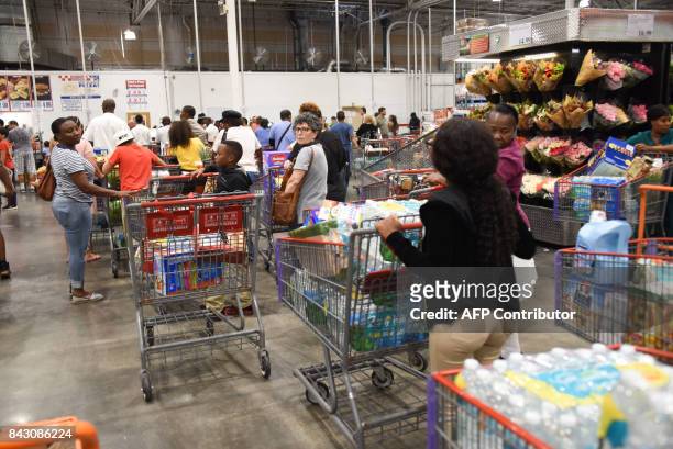 Very long checkout lines at Costco as some people waited up to 8 hours to check in, shop and leave in preparation for Hurricane Irma on September 5,...