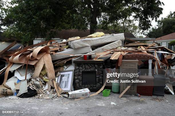 Fireplace sits in the middle of a trash pile in front of a flood damaged home on September 5, 2017 in Houston, Texas. Over a week after Hurricane...