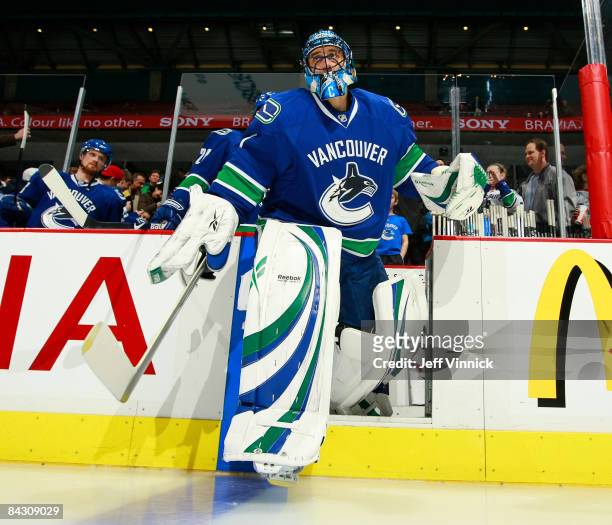 Roberto Luongo of the Vancouver Canucks steps onto the ice for the first time after returning from an injury before their game against the Phoenix...