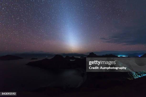 zodiacal light over the padar island, indonesia. - zodiacal light stock pictures, royalty-free photos & images